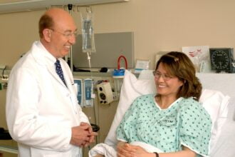 doctor next to patient's bed