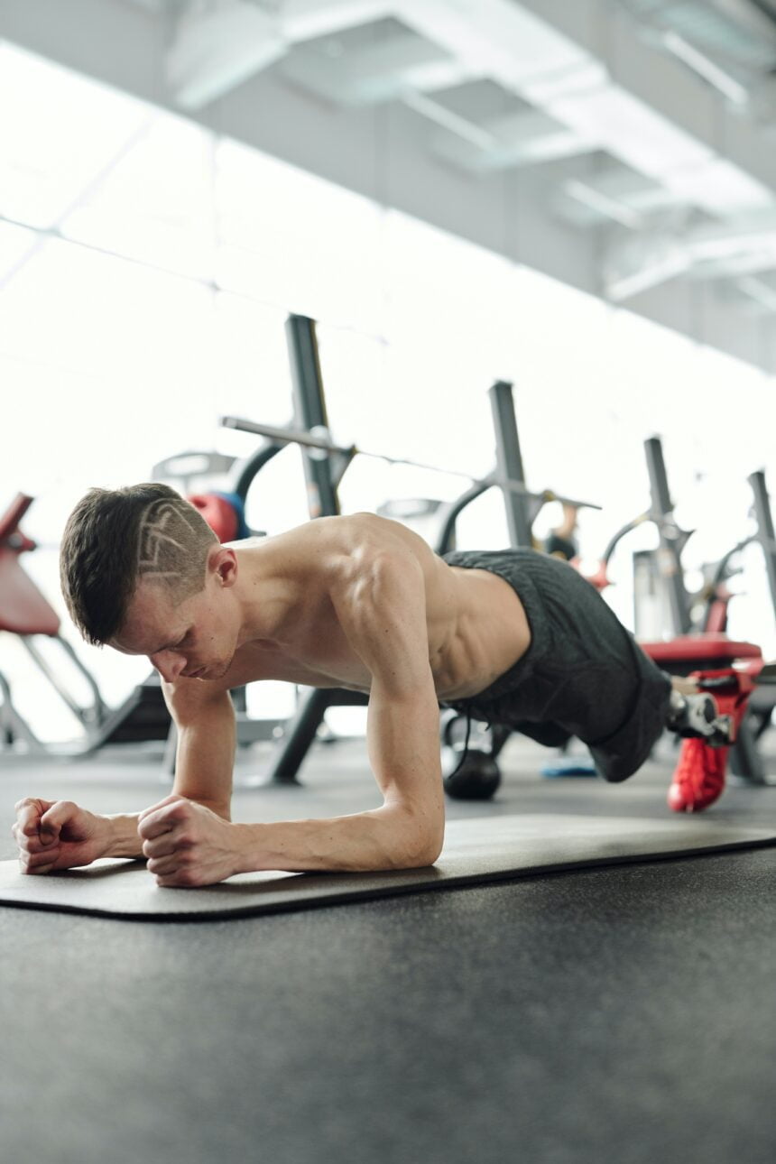 Man in black shorts doing planking