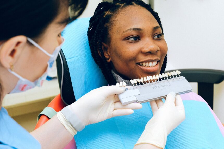 smiling ethnic lady visiting dentist in modern clinic