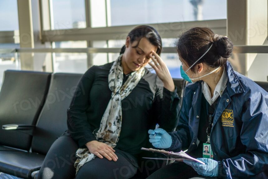 A healthcare worker assessing a sick