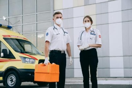 paramedics in surgical gloves and masks