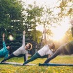 outdoor yoga class in sunny park setting