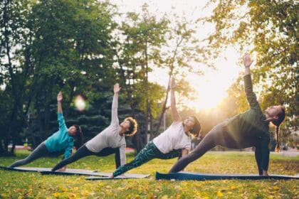 outdoor yoga class in sunny park setting
