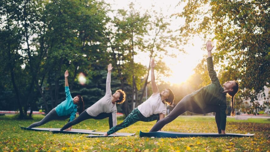 outdoor yoga class in sunny park setting