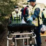 emergency medical simulation with rescue team outdoors